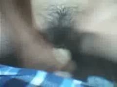 A stunning Asian woman pokes her cunt and squishes her boobs.